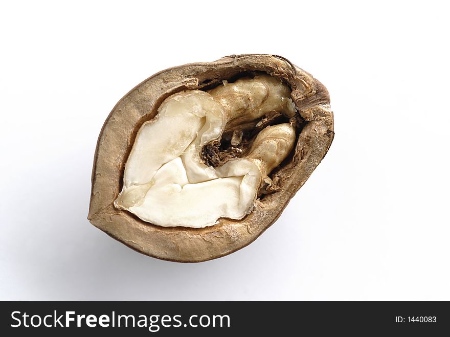 Half of a walnut on white background
