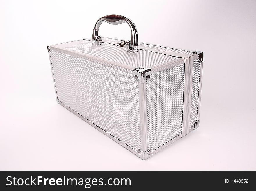 Shining silver case for accessories over white background.