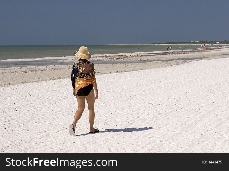 Woman Walking on the Beach