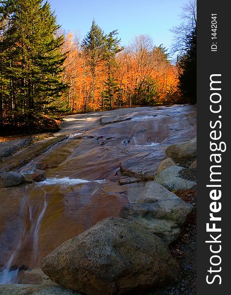 Stream flows over rock ledge. Stream flows over rock ledge.