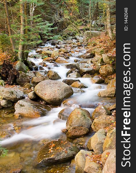 Stream flowing through a field of rocks. Stream flowing through a field of rocks.