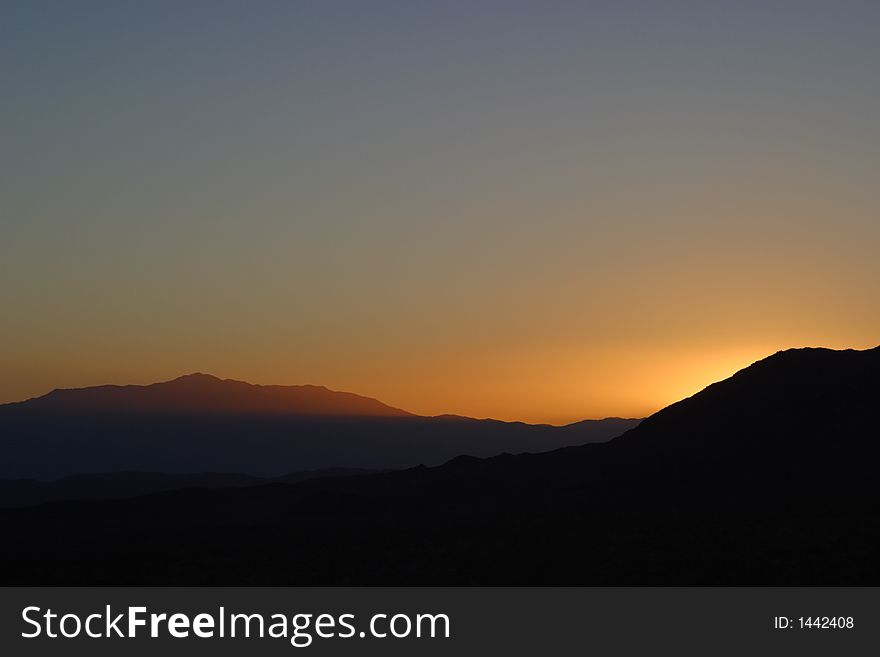 Sunset in Joshua Tree National Park with light shaft. Sunset in Joshua Tree National Park with light shaft