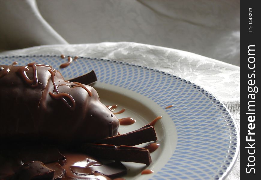 Chocolate croissant with dark chocolate and chocolate sauce