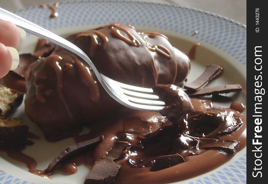 Chocolate croissant with dark chocolate and chocolate sauce