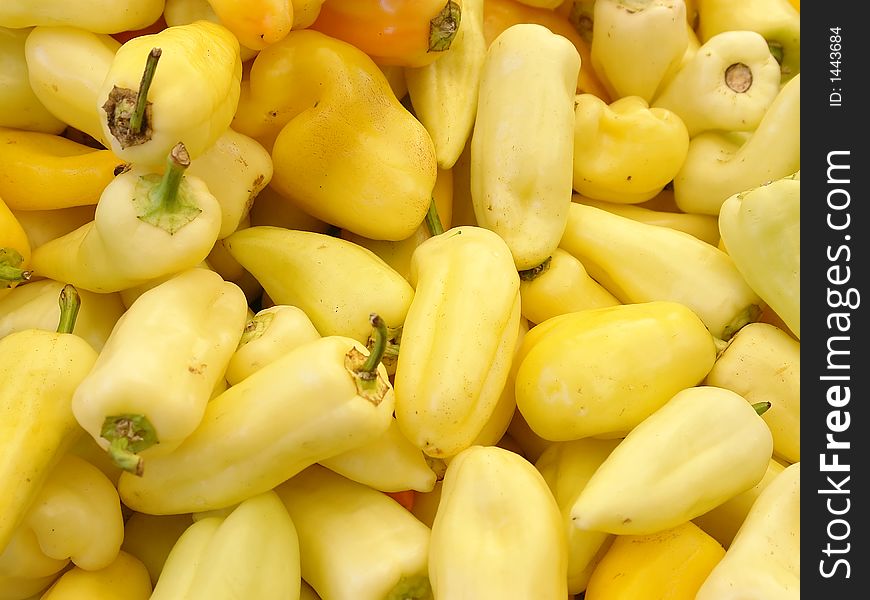 Background of yellow pepper on a market stall