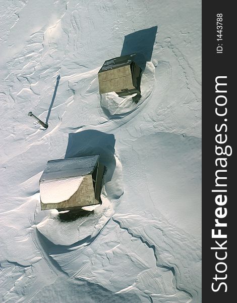 The image of a roof covered with snow. The top view. The image of a roof covered with snow. The top view
