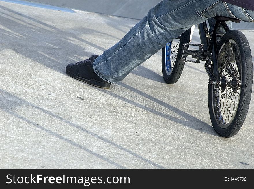 Close up of male leg on bike. Close up of male leg on bike