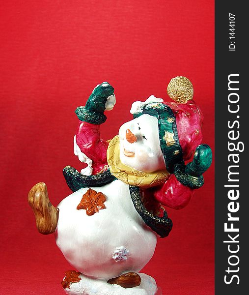 A funny snowman in a beatiful red background