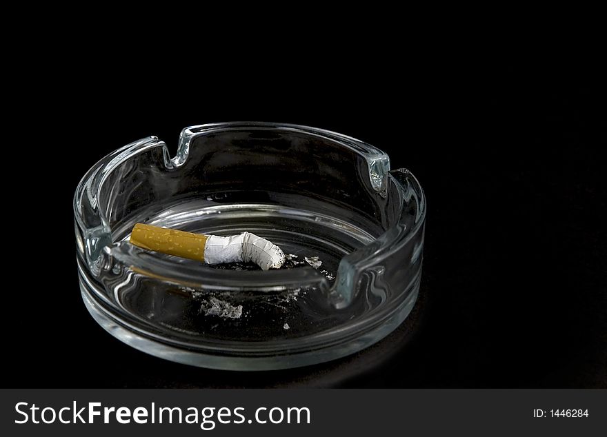 Cigarette in ashtray