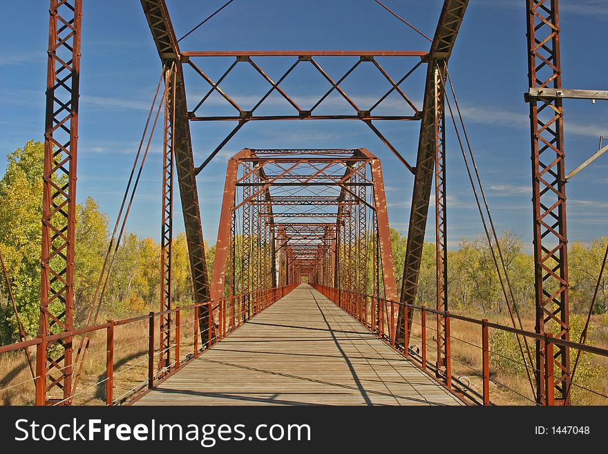 Old covered wagon bridge spanning the canadian river in Texas. Old covered wagon bridge spanning the canadian river in Texas