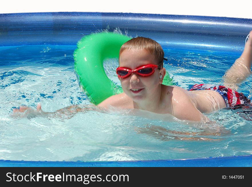 Child playing in the swimming pool. Child playing in the swimming pool