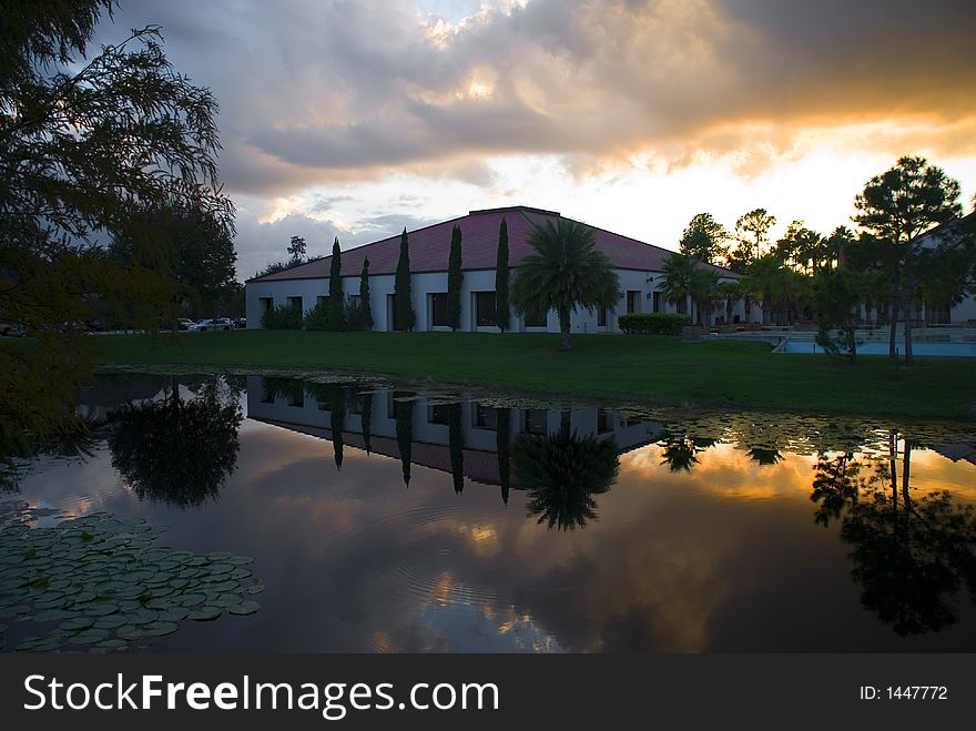 A Commercial building with a water reflection at sundown. A Commercial building with a water reflection at sundown