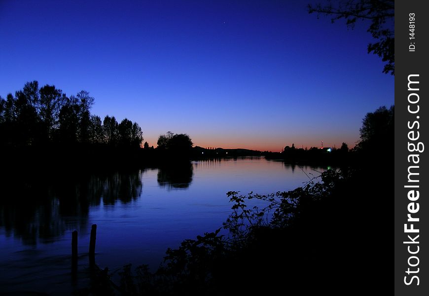 Beautiful blue sunset over the Skagit River,  Washington state, USA. Beautiful blue sunset over the Skagit River,  Washington state, USA