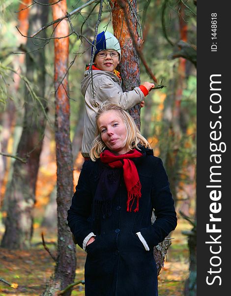 Mother and son in an autumn wood