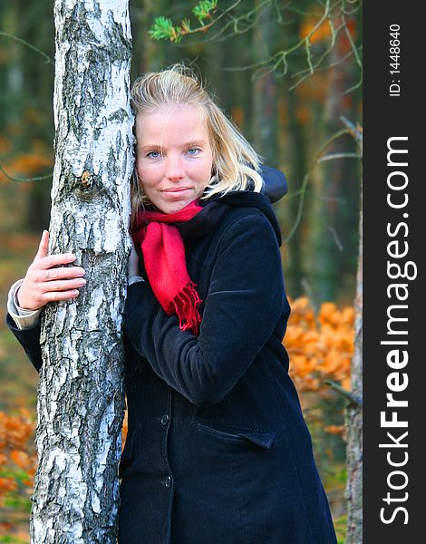 Blonde woman in an autumn wood. Blonde woman in an autumn wood