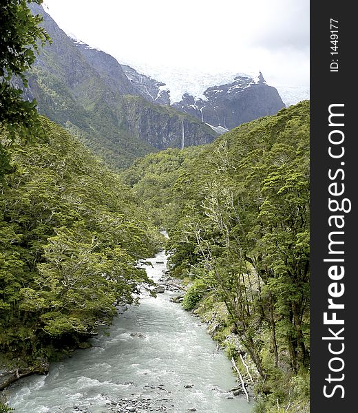 Glacier torrent flowing down into valley. Glacier torrent flowing down into valley