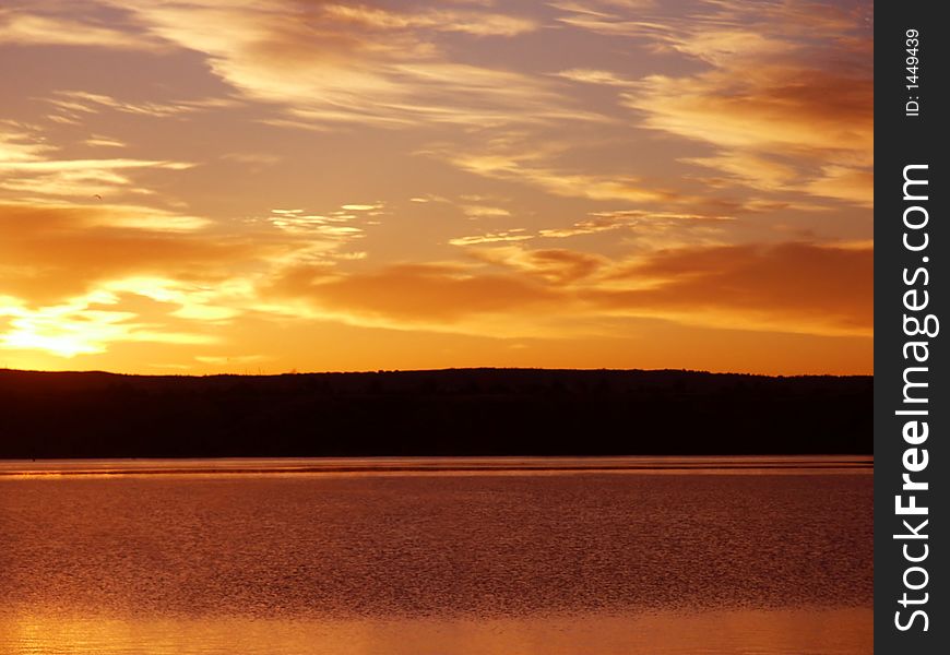 Orange Sunrise On a Lake in Colorado