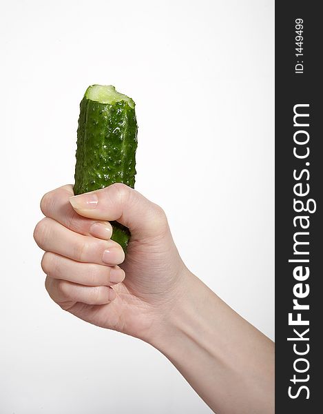 Hand with cucumber on white isolated background