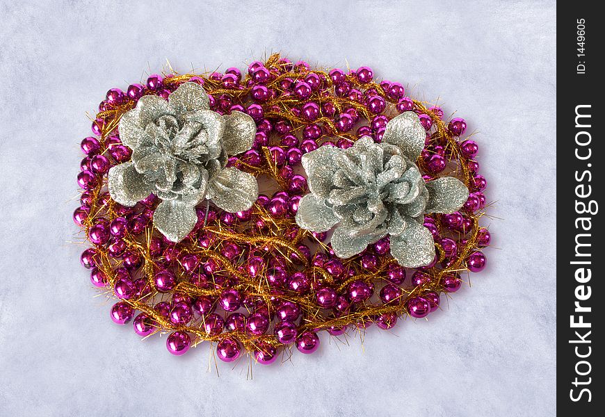 Garland and silver pinecones on the snow