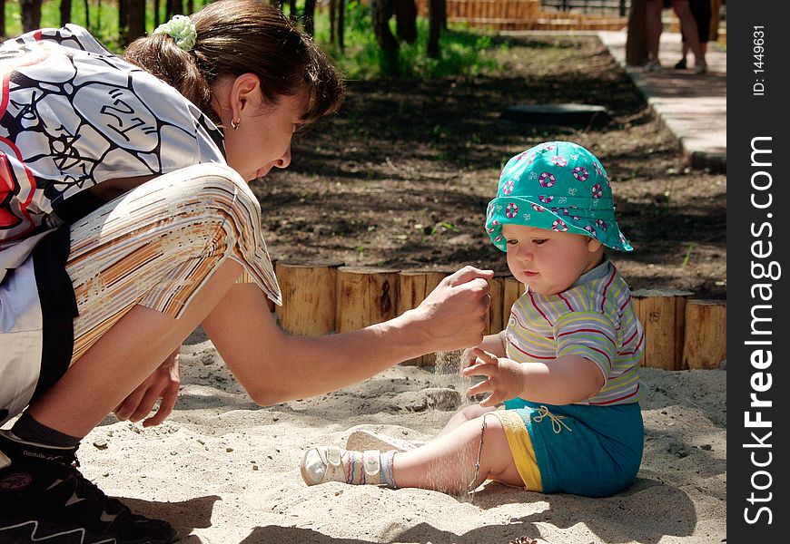 Game in a sandbox summer free day child little boy baby