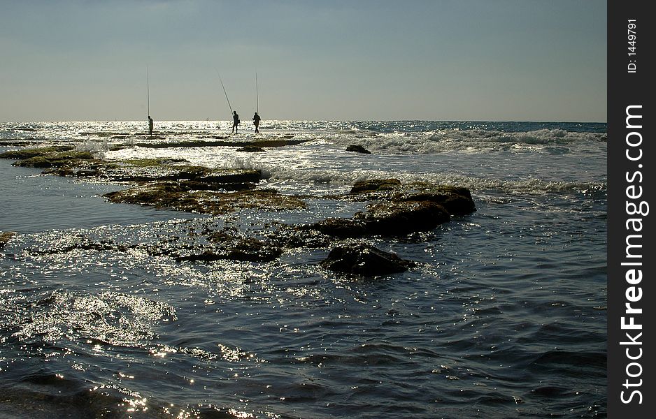 Fishermens in the mediteranian sea in Ceasarea Israel. Fishermens in the mediteranian sea in Ceasarea Israel