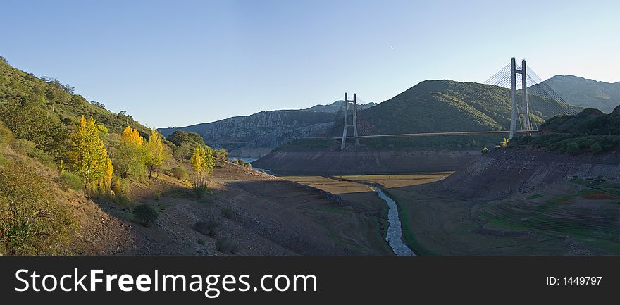 Highway bridge across dried reservoir, in LeÃ³n, northern Spain, autumn 2006 as water shortages are hitting Spain.