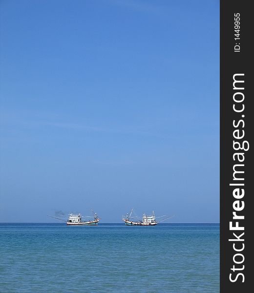 Two ships passing each other in the ocean off Thailand Coast. Two ships passing each other in the ocean off Thailand Coast.