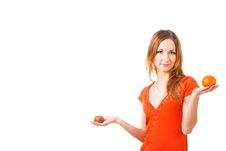 Young Pretty Girl In Dress With Orange And Kiwi Royalty Free Stock Images Young Pretty Girl In Dress With Orange And Kiwi Royalty Free Stock Images