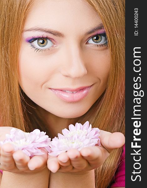 Young pretty girl with flowers portrait. Young pretty girl with flowers portrait