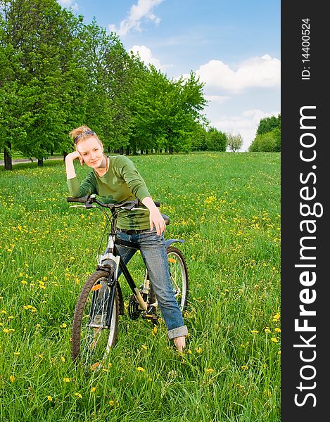 Outdoor shoot of young woman with bicycle