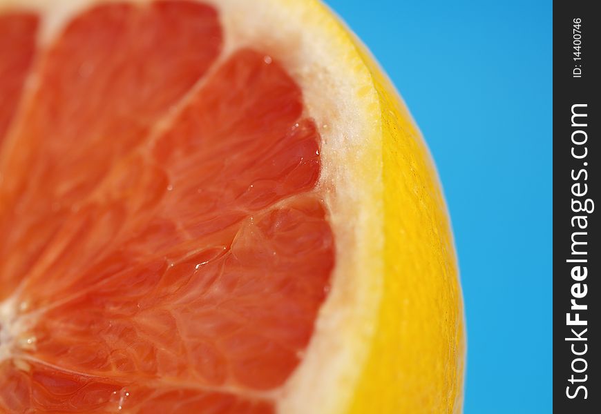 Pies of grapefruit on blue background