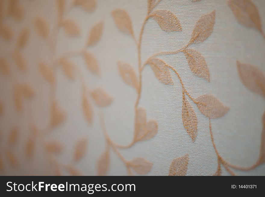 Close up of brown floral pattern on wallpaper. Close up of brown floral pattern on wallpaper