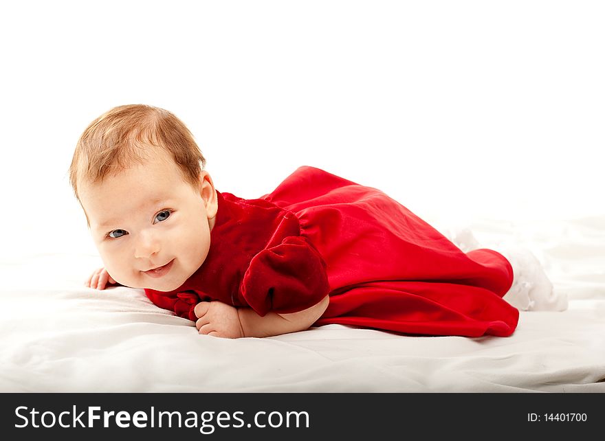 Cute baby girl in beautiful red dress