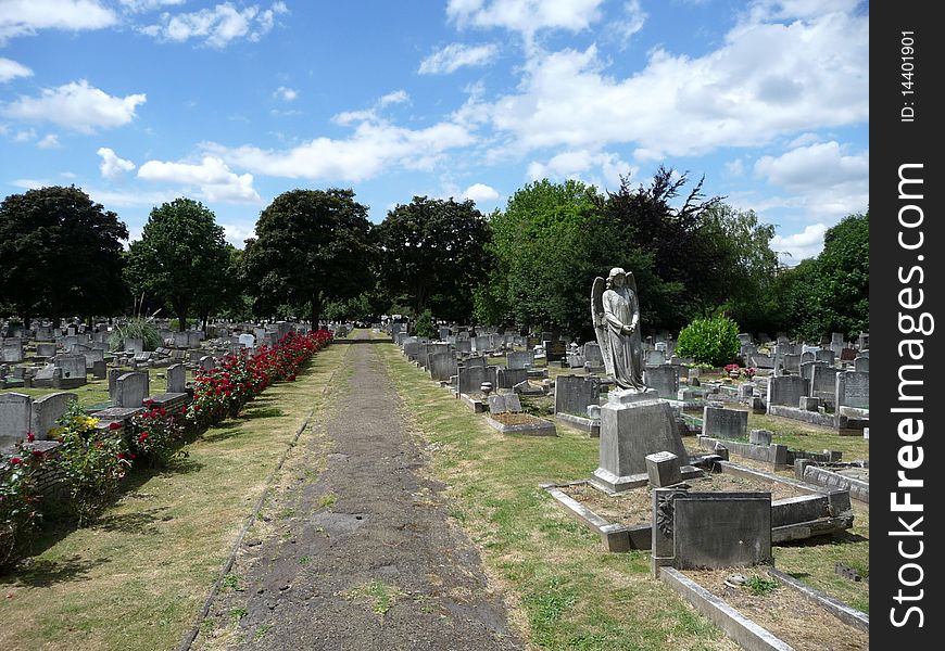 An stone angel in a London graveyard. An stone angel in a London graveyard.