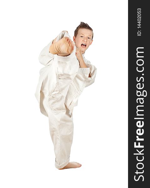 Young boy training karate. Isolated on white background. Young boy training karate. Isolated on white background