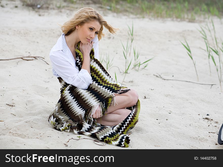 Young girl relaxing on the beach. Young girl relaxing on the beach