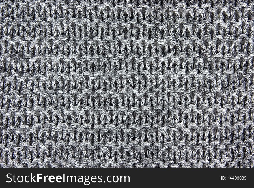 Gray woollen knitted fabric background