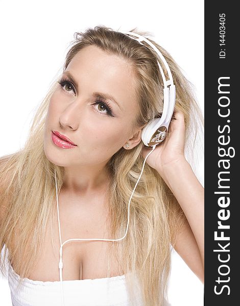 Women listenig to music in white headphone. Women listenig to music in white headphone
