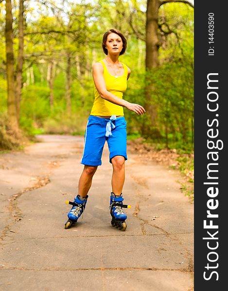 Pretty young woman rolling in park. Pretty young woman rolling in park