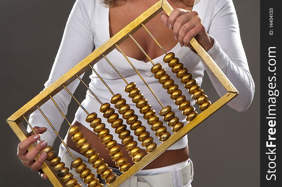 Girl Holding A Golden Abacus