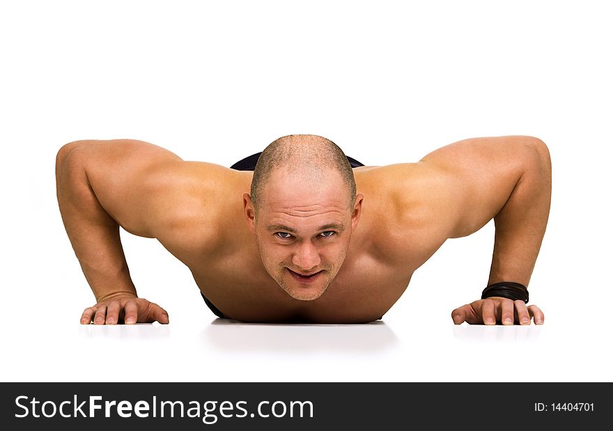 Front view of strong, handsome man doing push-ups as bodybuilding exercise, training his muscles. Isolated on white. Front view of strong, handsome man doing push-ups as bodybuilding exercise, training his muscles. Isolated on white.