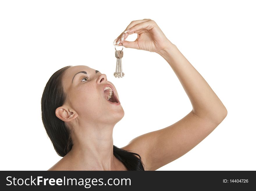 Young woman swallows of keys isolated in white