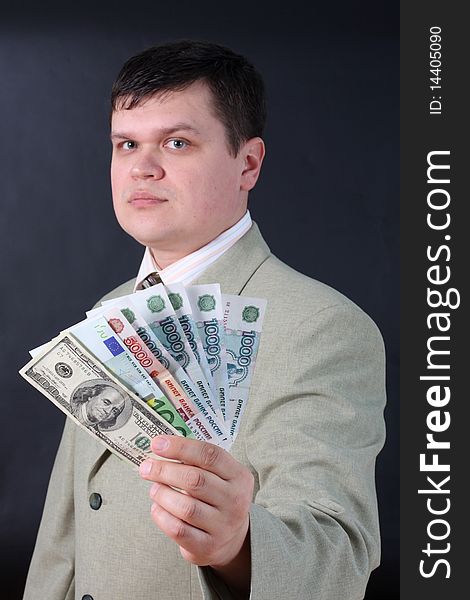 Man with money for a black background