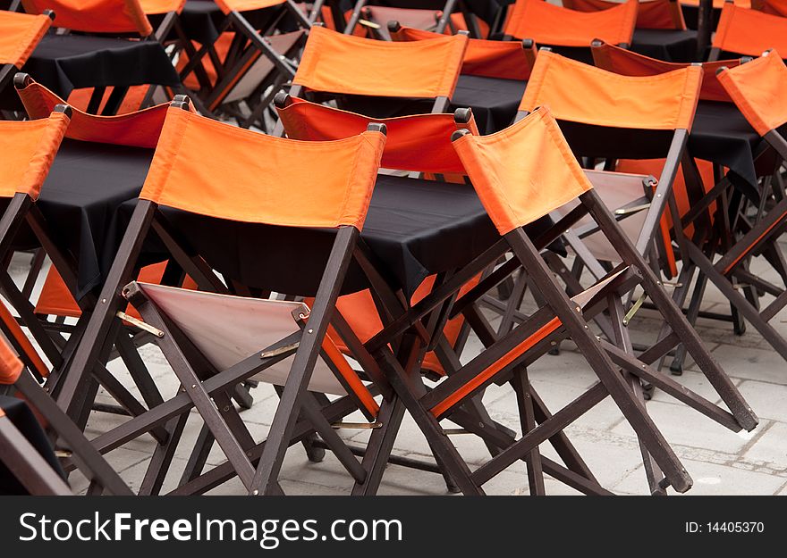 Tables and chairs in closed open-air cafe. Tables and chairs in closed open-air cafe