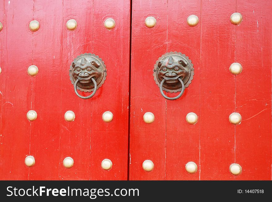 Door handle at the temple with red background. Door handle at the temple with red background