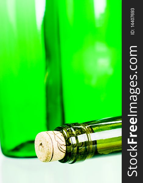 Green wine bottles on white background