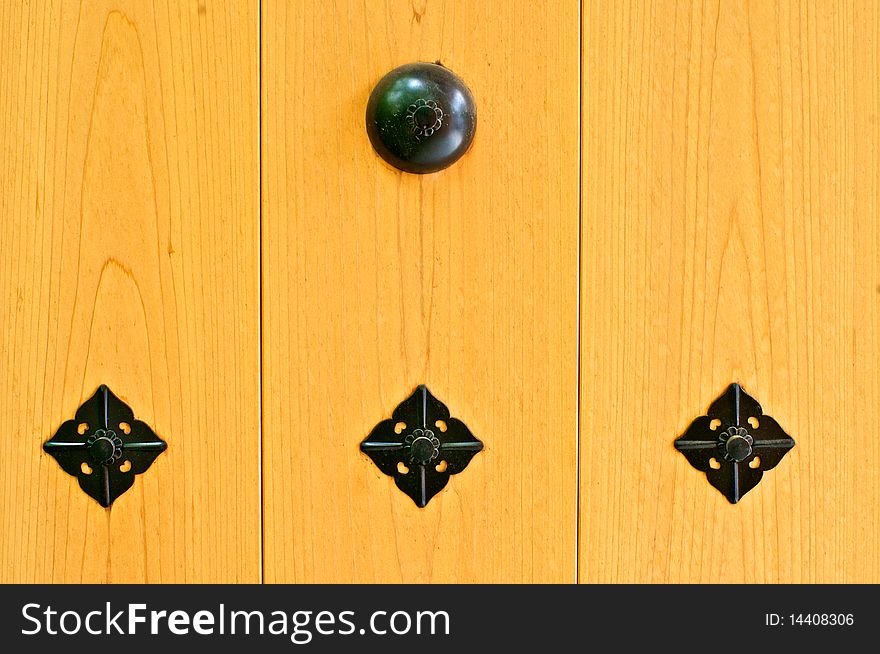 An ornamental door at a Shinto temple. An ornamental door at a Shinto temple