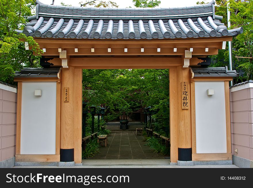 The exterior of a Shinto temple with light colored wood walls. The exterior of a Shinto temple with light colored wood walls