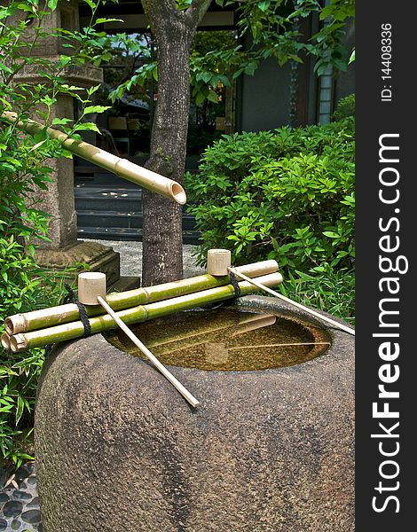 Purification fountain found in a Shinto temple. Purification fountain found in a Shinto temple