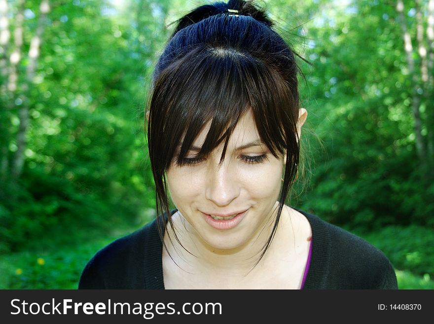 Looking down smiling girl portrait